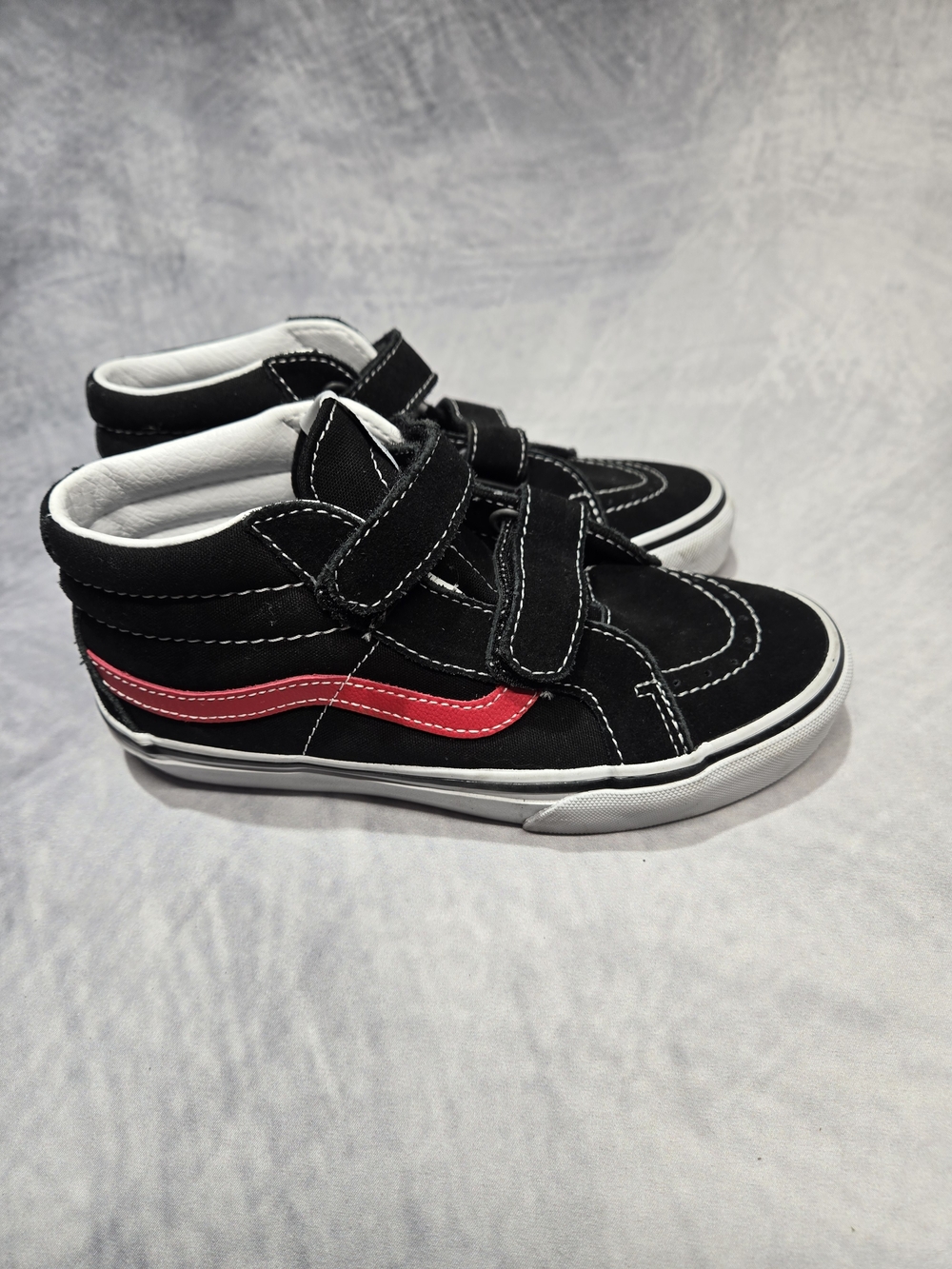 Vans Kids' Sk8-Mid Reissue V in a black and red colorway